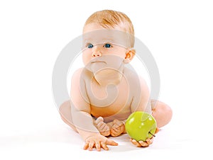 Food, health and child concept. Cute baby with green apple on a