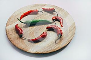 Food, healthy eating and nutrition concept - sliced pumpkin and other vegetables on wooden board