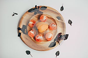 Food, healthy eating and nutrition concept - sliced pumpkin and other vegetables on wooden board