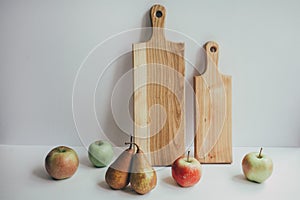 Food, healthy eating and nutrition concept - sliced pumpkin and other vegetables on wooden board