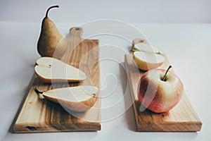 Food, healthy eating and nutrition concept - sliced pumpkin and other vegetables on wooden board