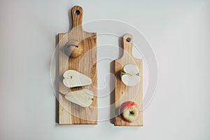 Food, healthy eating and nutrition concept - sliced pumpkin and other vegetables on wooden board