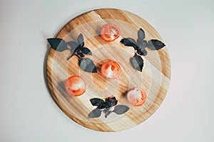 Food, healthy eating and nutrition concept - sliced pumpkin and other vegetables on wooden board