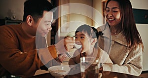 Food, home and Japanese parents and child at table for lunch, breakfast and eating meal together. Happy family, culture