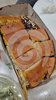 Food Indonesian street food martabak manis chocolate cheese pancake local food dish dessert bake in a paper box