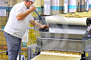 Food industry - biscuit production in a factory on a conveyor be