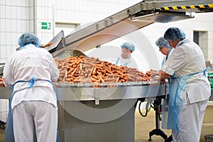 Food industry: workers in the production of original German brat