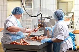Food industry: workers in the production of original German brat