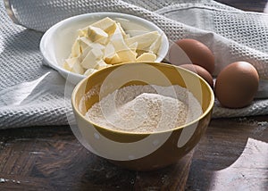 Food ingredients for baking: flour, eggs, butter