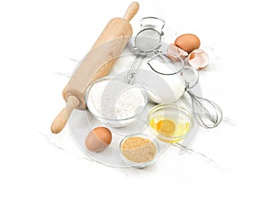 Food ingredients eggs flour sugar milk Kitchen tools Dough preparation