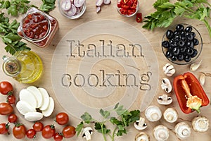 Food ingredients and spices for cooking italian pizza on wooden table - mushrooms, tomatoes, cheese, onion, oil, pepper, salt, bas