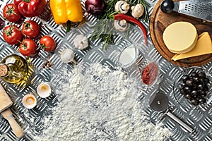 Food ingredients and spices for cooking pizza. Mushrooms, tomatoes, cheese, onion, oil, pepper, salt, egg, grater on