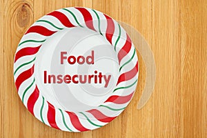Food insecurity on empty plate on a wood table photo