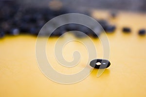 Food item - black beans grains with a warm and yellow background