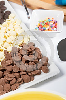 Food, junk-food, culinary, baking and eating concept - close up of jelly beans candies and chocolate on table