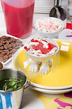 Food, junk-food, culinary, baking and eating concept - close up of jelly beans candies and chocolate on table