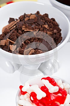 Food, junk-food, culinary, baking and eating concept - close up of jelly beans candies and chocolate on table