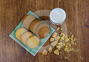 Food, junk-food, culinary, baking and eating concept - close up oatmeal cookies and milk glass