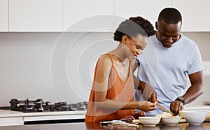 Food, love and black couple in a kitchen for cooking, meal and bonding in their home together. Nutrition, lunch and