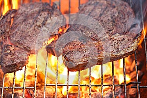 Food meat - rib eye beef steak on party summer barbecue grill wi