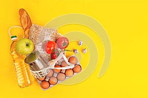 Food packaging on yellow background. Quarantine food delivery home. Flatlay banner with copyspace