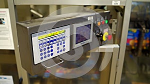 Food packing machine's control panel with a lot of colored buttons