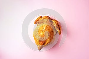 Food pattern. Roast whole turkey or chicken on pink background. Top view. Festive family dinner. Thanksgiving day concept.