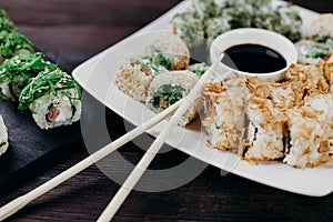 Sushi rolls with salmon, tuna and avocado