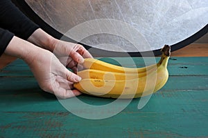 Food Photographer Photographing Fresh Banana Bunch in Studio