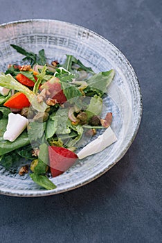 Food photography of a fresh vegetables and feta salad. Mediterranean diet. Fresh vegetarian dish