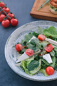 Food photography of a fresh vegetables and feta salad. Mediterranean diet. Fresh vegetarian dish