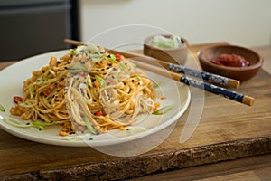 Food photography of an Italian Chinese fusion dish of mie noodles with bamboo pesto