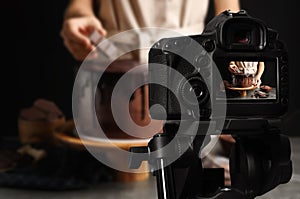 Food photography. Shooting of chef decorating chocolate cake
