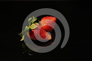 Food photography. Strawberry on the black background photo