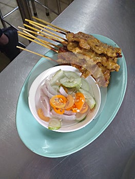 Food: Pork Satay. Traditional Thai food in the restaurant at Bangkok.