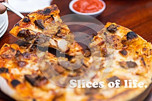 Food quote - Slice of life. With a serving of pizza as the out of focus background