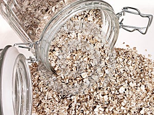 Food: Raw Oats Spilling Out of Glass Jar
