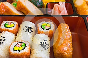 Food replicas of rolled cooked vinegary rice and sushi in Bento