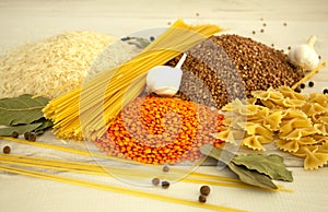 Food: rice, buckwheat, spaghetti, pasta and lentils on the table