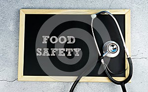 FOOD SAFETY wrote on chalkboard with stethoscope