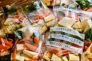 Vegetables in pouches prepared for freezing, parsley, celery, carrots photo