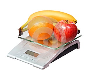 Food scale with fruits apple banana and orange isolated