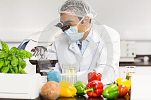 Food scientist using the microscope