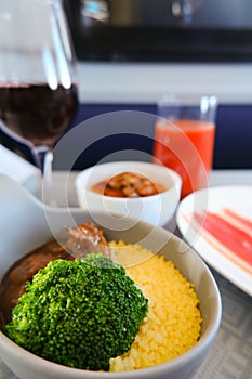 Photo of Food served on board of business class airplane on the table