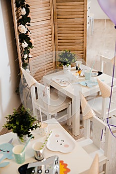 Food served on table in a white hall during a children Birthday party decoration in Eastern European Baltic Riga Latvia