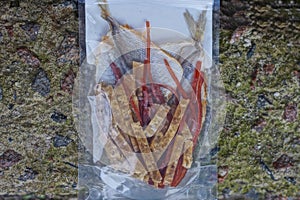 food set of small cut sea dry fish and dried squid in a transparent bag