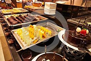 Food on the shelves in the self-service buffet with all inclusive in hotel in Turkey. Many options for sweet dishes and cakes