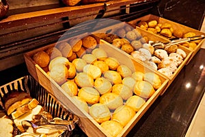 Food on the shelves in the self-service buffet with all inclusive in hotel in Turkey. Many types of bread and loaf in the tray