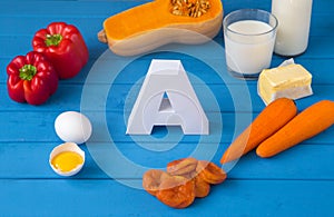 Food sources of natural vitamin A and letter A. Front view. Healthy diet concept