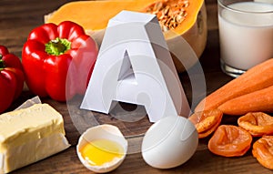 Food sources of natural vitamin A and letter A. Front view. Healthy diet concept